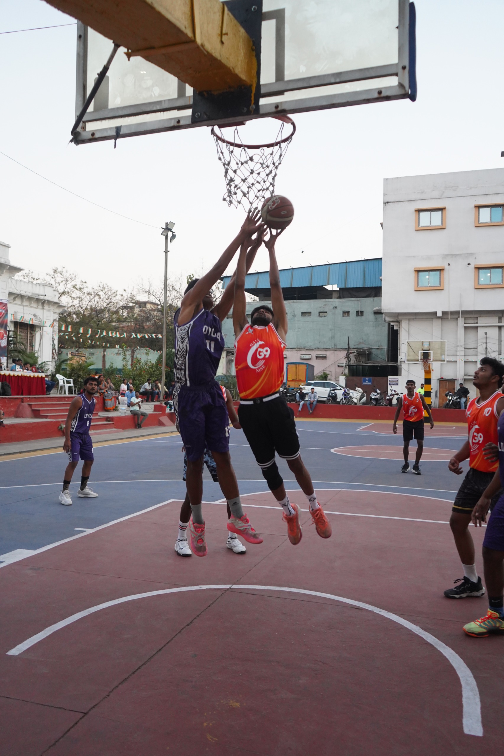 Aftab (Red-G9) and Vivek (Blue-Loyola) vie for the rebound