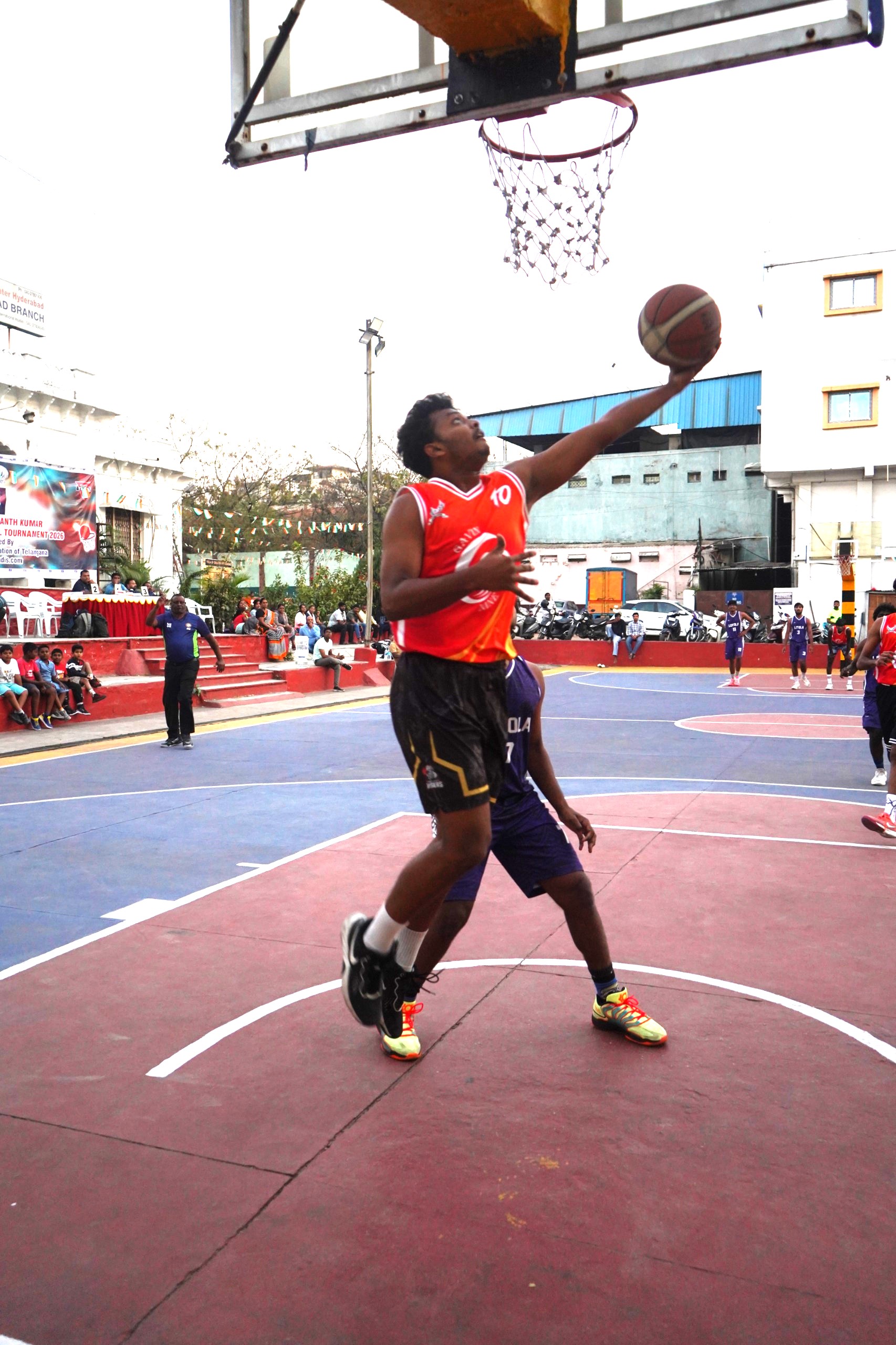 Sravan of G9 going for a layup shot against Loyola