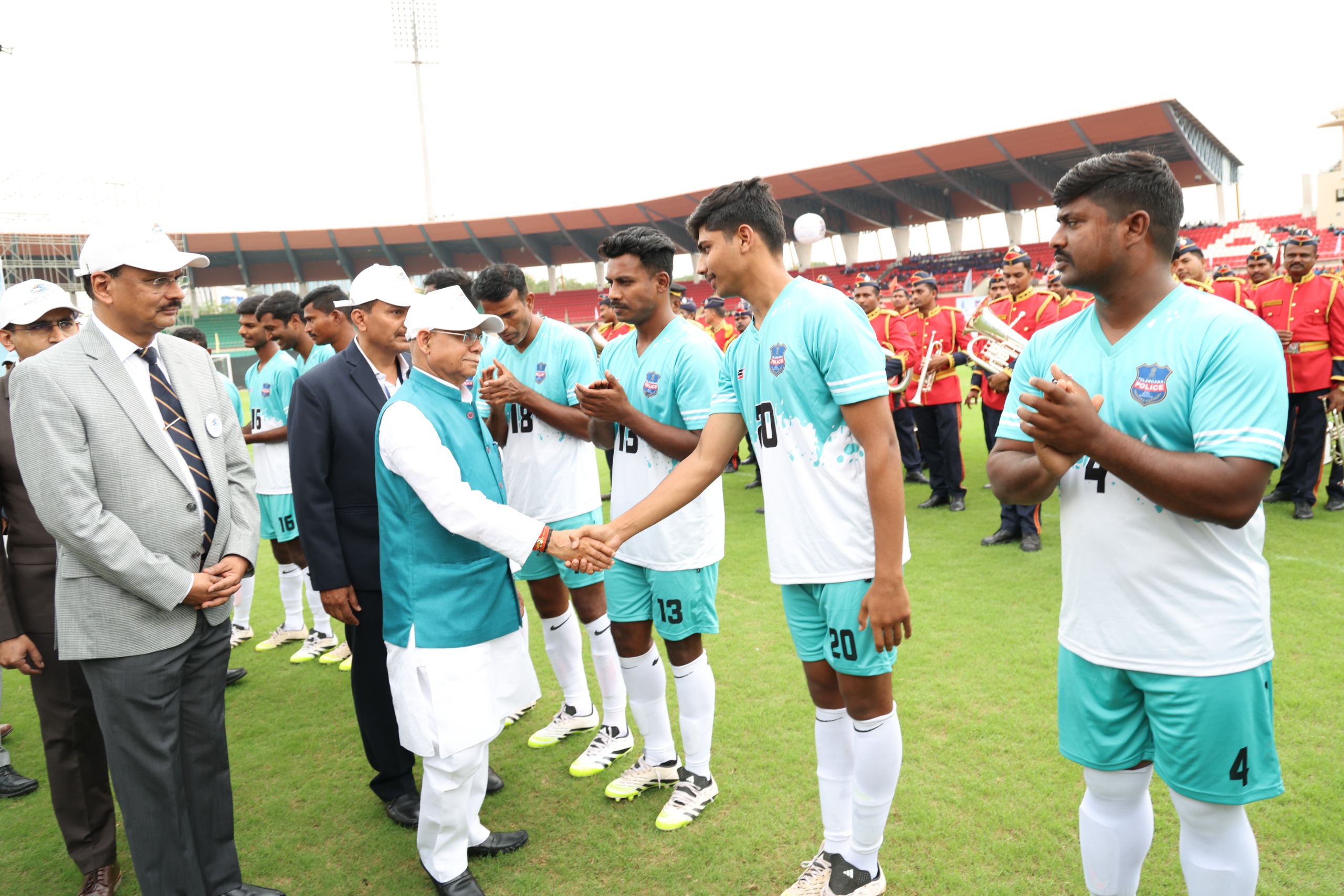 Telangana governor Shiv Pratap Shukla meeting the police football teams
