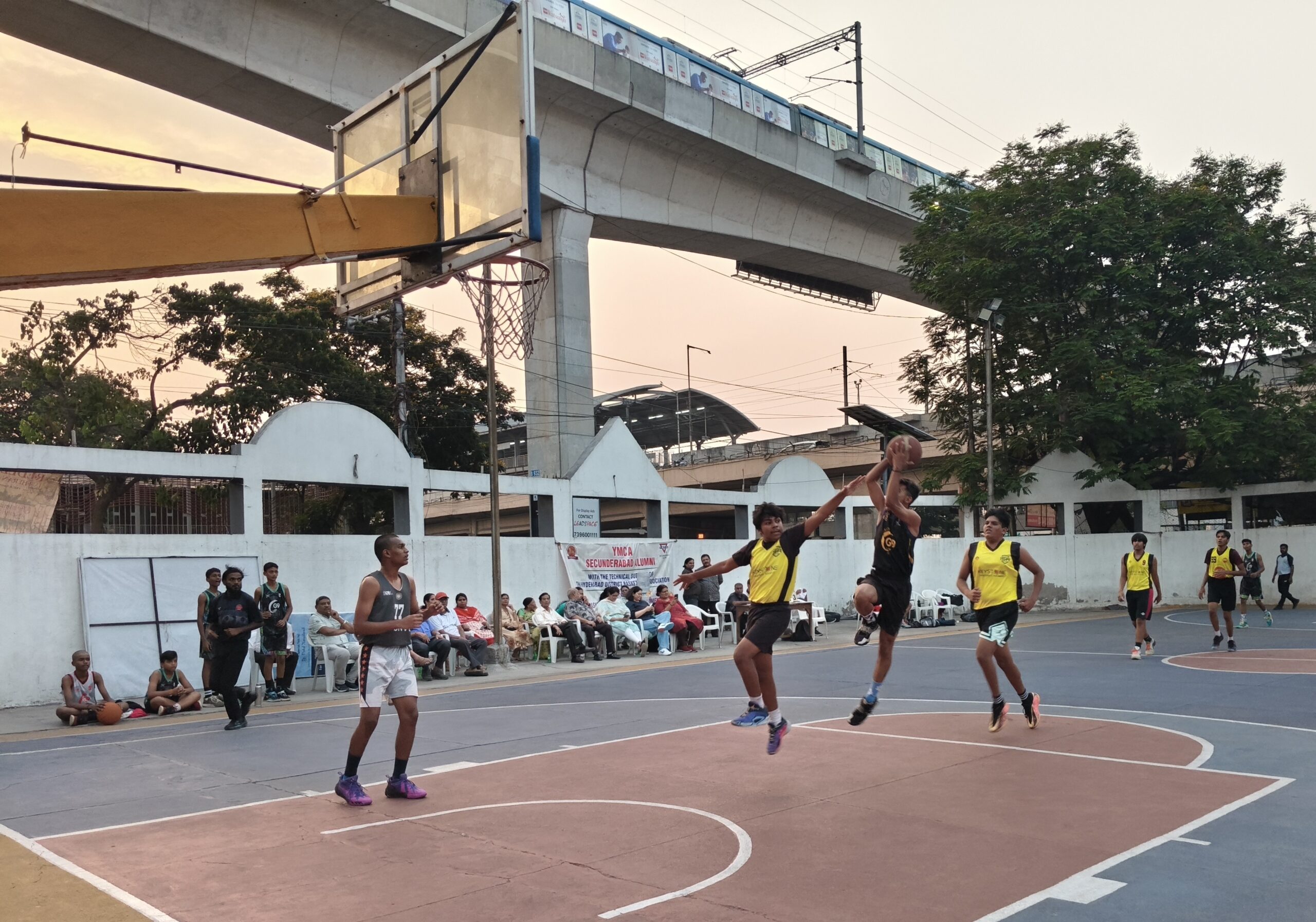 KVBR's Revanth (black) taking a shot as Trinity's Ayaan (Yellow) tries to defend