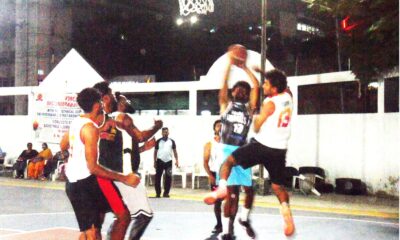 Sanathnagar's Bharath taking a shot as Titans' Surya tries to defend