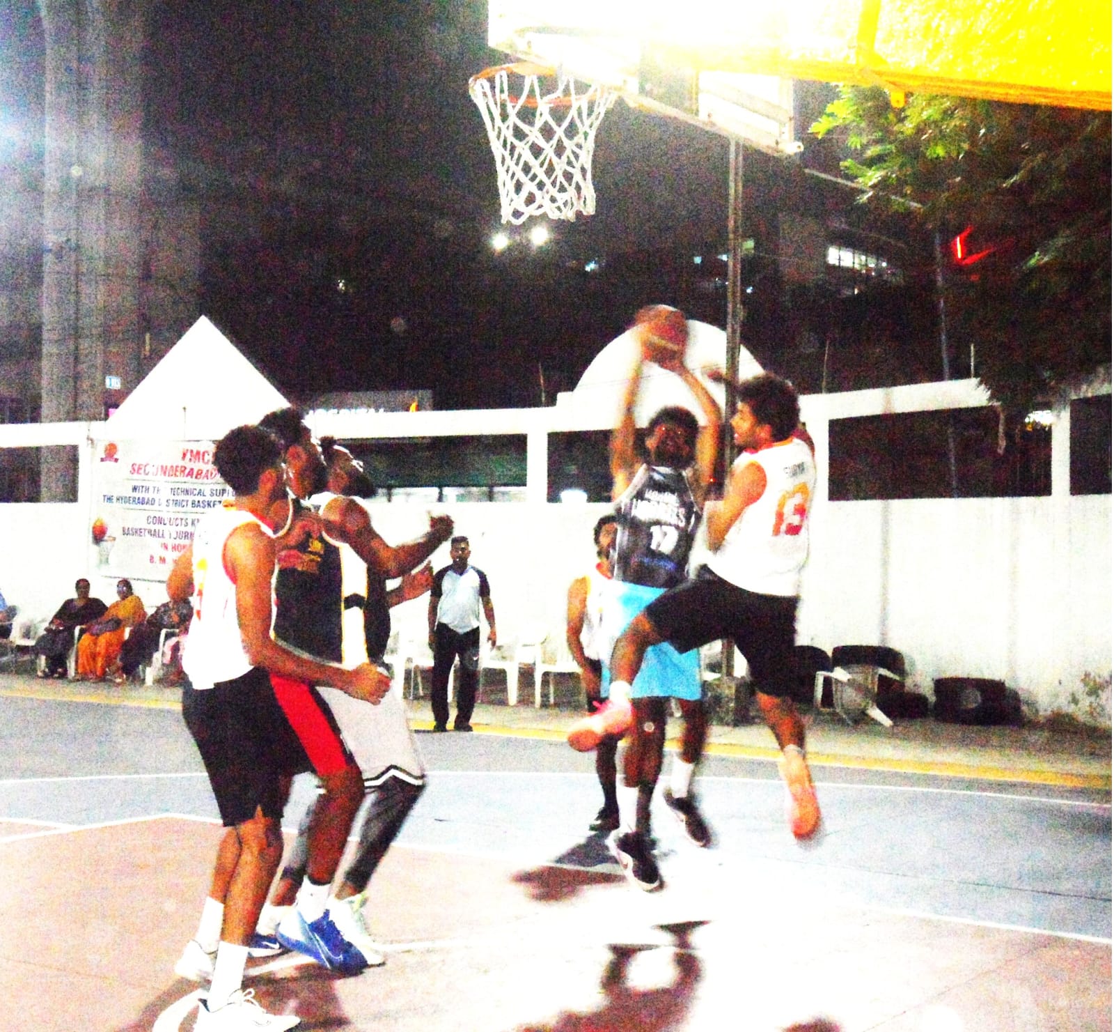Sanathnagar's Bharath taking a shot as Titans' Surya tries to defend
