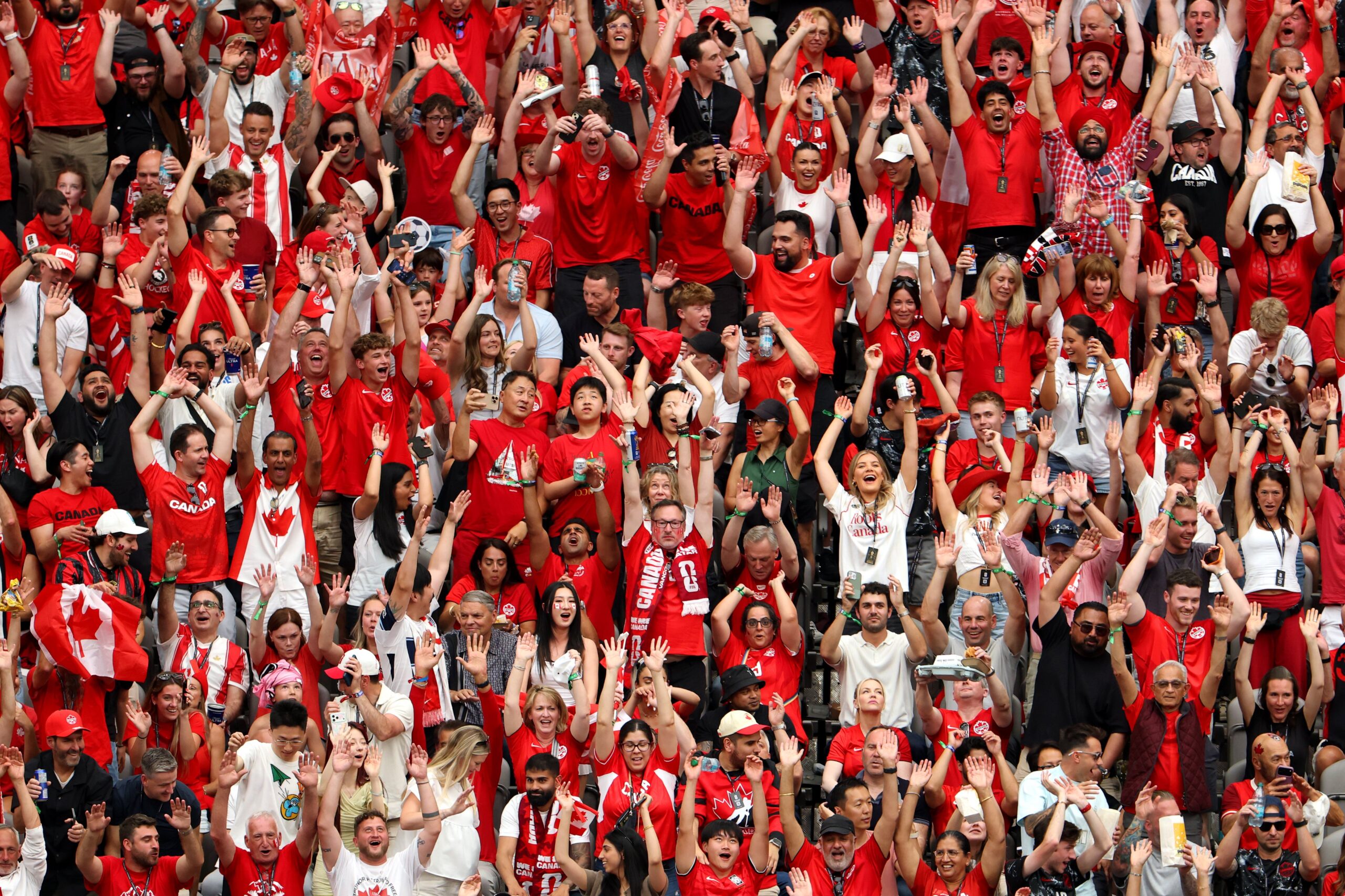 Canada fans celebrate their team win over Qatar in the World Cup