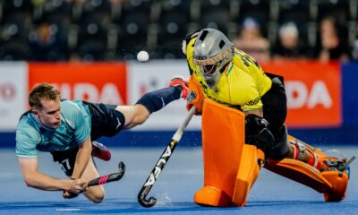 Indian goalie thwarts an England player from scoring