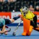 Indian goalie thwarts an England player from scoring