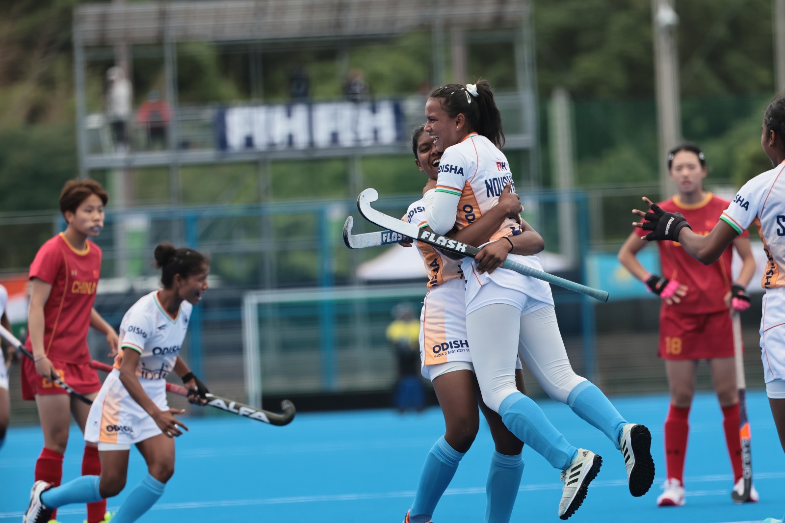 Indian hockey players celebrate their goal against China