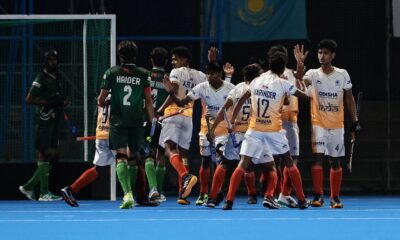 Indian men celebrate a goal against Pakistan