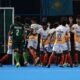 Indian men celebrate a goal against Pakistan