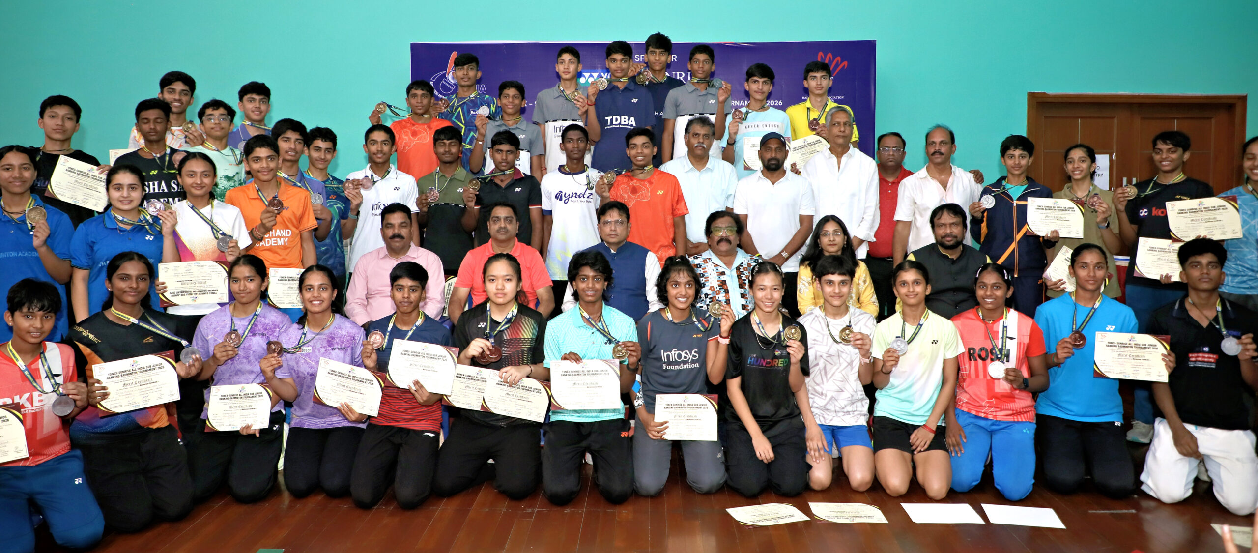 D Sridhar Babu with the winners and runners-up of Yonex Badminton