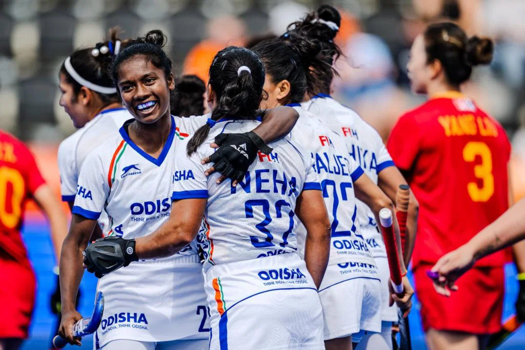 Indian players celebrate a goal against China
