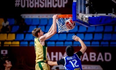 Isaac Riddle of Australia dunks the ball against Chinese Taipei