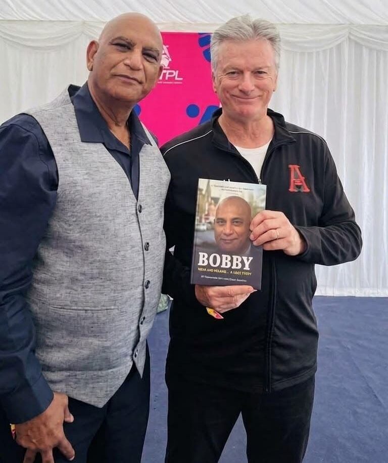 MV Narasimha Rao (Bobjee) presents his book to Steve Waugh