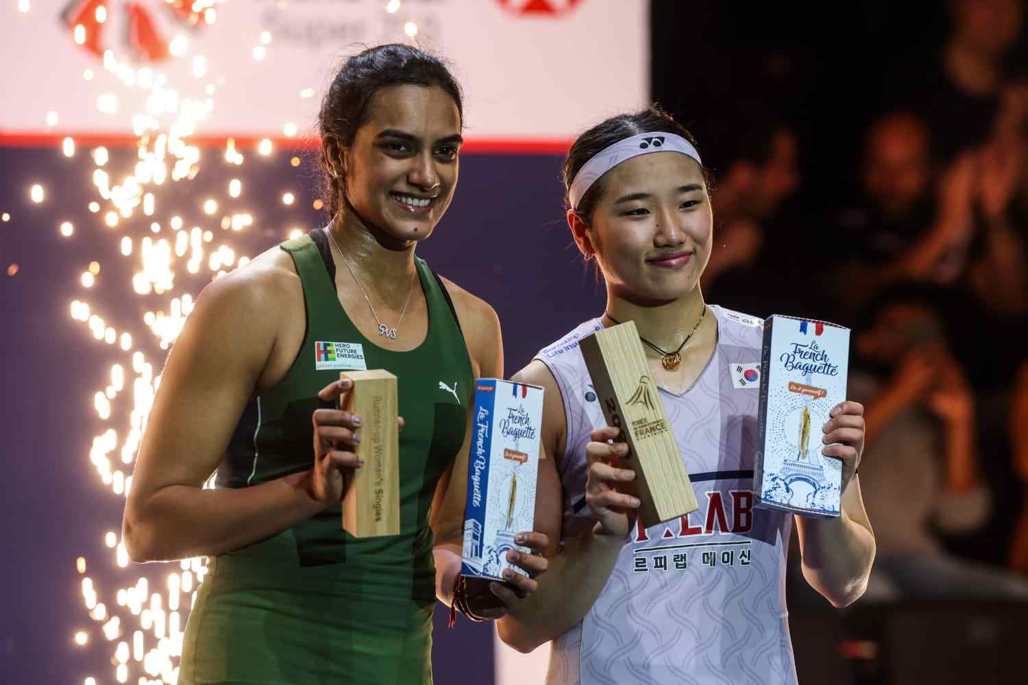 PV Sindhu and An Se Young pose with their trophies 